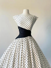 Cap Sleeve Vintage 50s Polka Dot Swing Dress with Black Asymmetrical Waist Panel - DollyGown